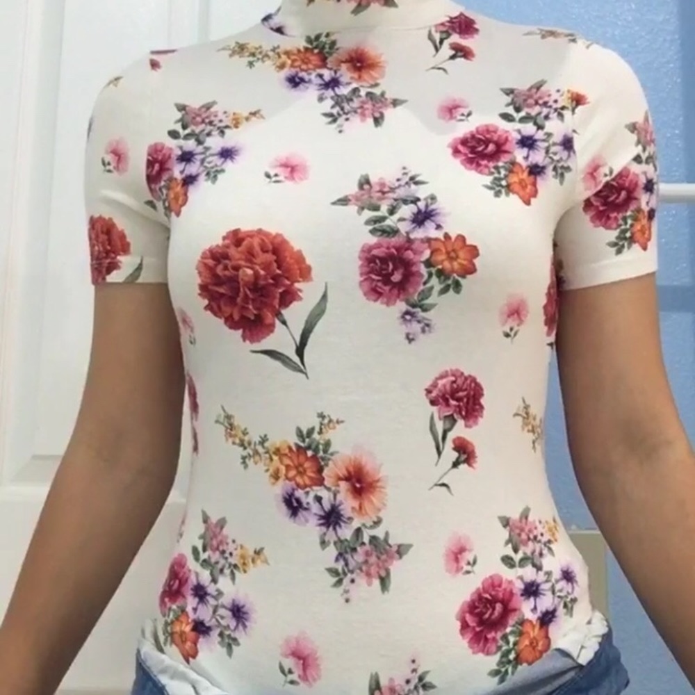 a white floral bodysuit